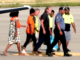 Police Commissioner David Manning (right) escorts the the three last hostages to be released by the gunmen