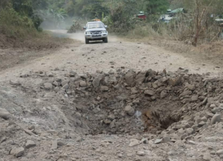 An airstrike narrowly misses a civilian vehicle in Myanmar