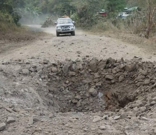 An airstrike narrowly misses a civilian vehicle in Myanmar