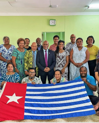 United Liberation Movement for West Papua president Benny Wenda (centre) with the Morning Star flag of independence and Fiji civil society members