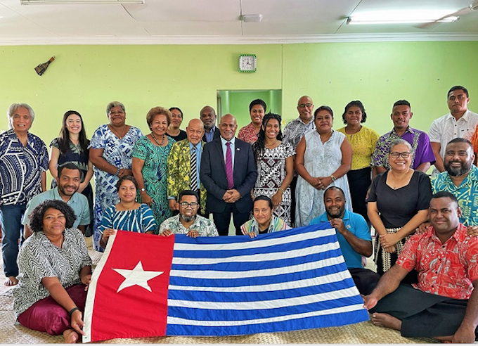 United Liberation Movement for West Papua president Benny Wenda (centre) with the Morning Star flag of independence and Fiji civil society members