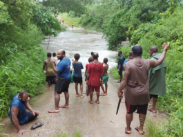A flooded road on Vanuatu's Efate island after Tropical Cyclone Kevin struck