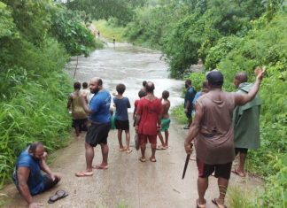 A flooded road on Vanuatu's Efate island after Tropical Cyclone Kevin struck