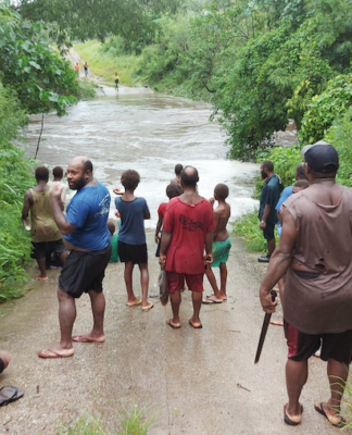 A flooded road on Vanuatu's Efate island after Tropical Cyclone Kevin struck