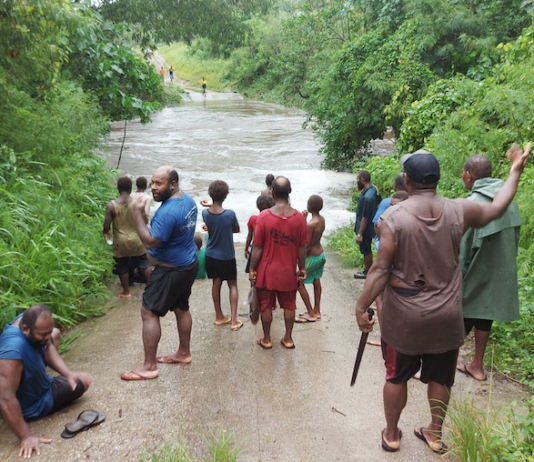 A flooded road on Vanuatu's Efate island after Tropical Cyclone Kevin struck