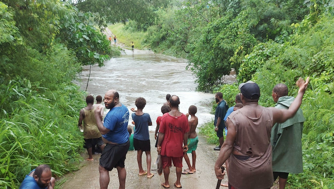 A flooded road on Vanuatu's Efate island after Tropical Cyclone Kevin struck