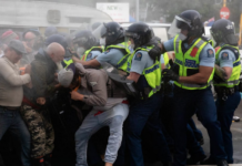 Police and protestors clash at the conclusion of the 2022 occupation at NZ's Parliament grounds