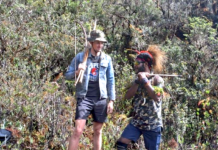 Pilot hostage Philip Mehrtens with one of his West Papuan rebel captors