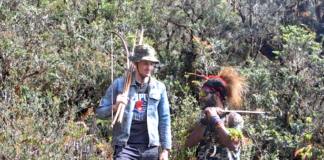Pilot hostage Philip Mehrtens with one of his West Papuan rebel captors