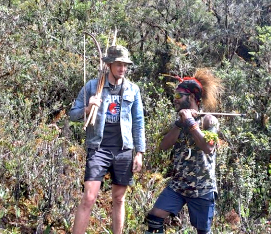 Pilot hostage Philip Mehrtens with one of his West Papuan rebel captors