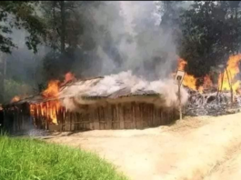 A burning West Papuan honai (traditional house) said to have been set alight by Indonesian troops