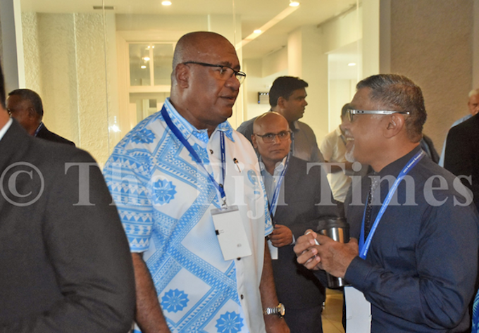 Health Secretary Dr James Fong (right) speaks to Deputy Prime Minister Manoa Kamikamica