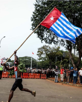 Indonesia upgrades NZ pilot operation in West Papua to ‘combat ready’ A lone protester raises the Morning Star flag of West Papua