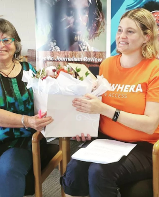 Asia Pacific Media Network chair Dr Heather Devere presents a bouquet to Tuwhera's Donna Coventry