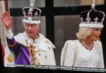 King Charles III and Queen Camilla wave from the balcony at Buckingham Palace