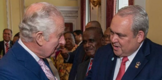 PNG Foreign Minister Justin Tkatchenko (right) - who has "stepped aside" - meets King Charles III