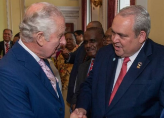 PNG Foreign Minister Justin Tkatchenko (right) - who has "stepped aside" - meets King Charles III