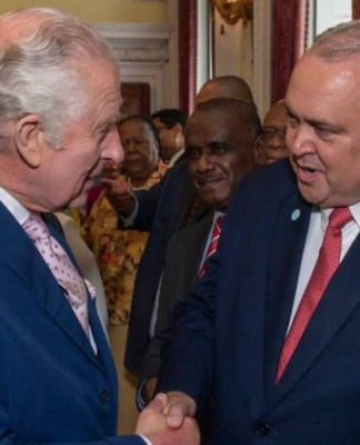 PNG Foreign Minister Justin Tkatchenko (right) - who has "stepped aside" - meets King Charles III
