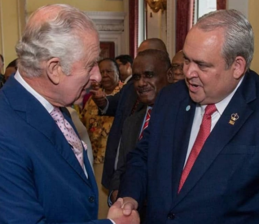 PNG Foreign Minister Justin Tkatchenko (right) - who has "stepped aside" - meets King Charles III