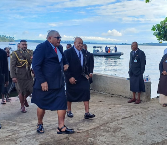 Fiji's President Ratu Wiliame Katonivere (front centre) arrrives on Bau Island