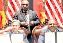 US Secretary of State Antony Blinken (from left), PNG Prime Minister James Marape (standing) and Defence Minister Win Daki after signing the US-PNG defence cooperation pact in Port Moresby