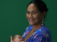 Tahitian anti-nuclear activist Hinamoeura Cross and her baby Marunui