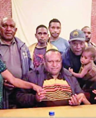 Some of the PNG teachers and their families after beating the kidnap bid