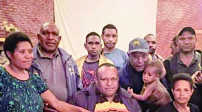 Some of the PNG teachers and their families after beating the kidnap bid