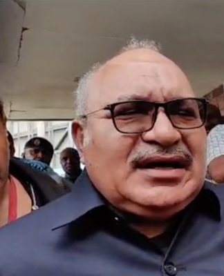 PNG former prime minister Peter O'Neill outside Boroko Police Station