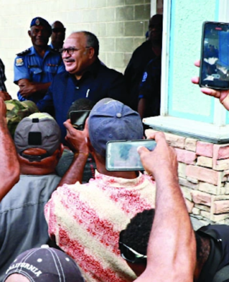 PNG former prime minister Peter O'Neill speaks to media