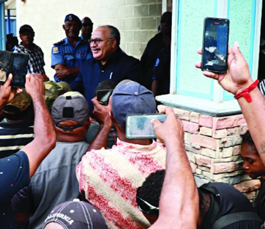 PNG former prime minister Peter O'Neill speaks to media