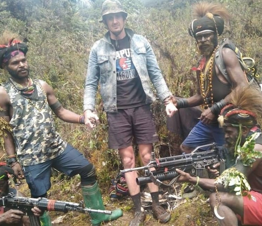 New Zealand pilot Phillip Mehrtens was photographed with his rebel captors in Indonesia's Papua region