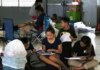 Young Guam students do school work