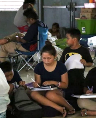 Young Guam students do school work