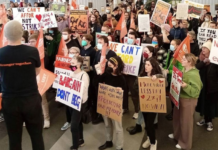 Striking Victoria University of Wellington staff and supporters protest over wages and conditions last October