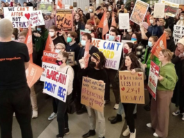 Striking Victoria University of Wellington staff and supporters protest over wages and conditions last October