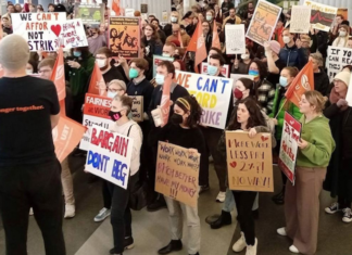 Striking Victoria University of Wellington staff and supporters protest over wages and conditions last October