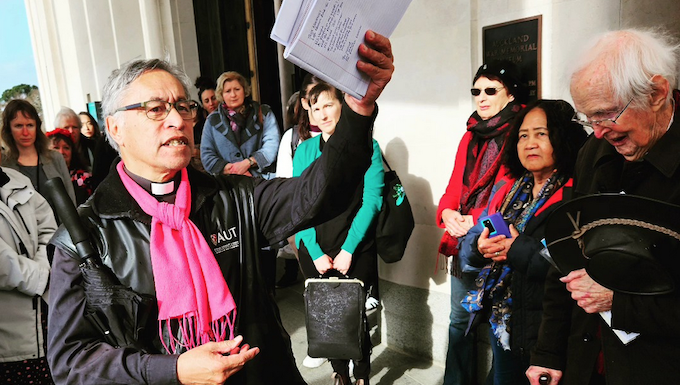 Legends of a Nuclear-Free and Independent Pacific – Rev Mua Strickson-Pua Activist minister Reverend Mua Strickson-Pua brandishes the petition against the AUKUS military pact at the launch