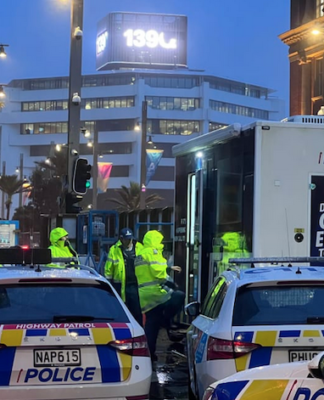 Police officers in high-vis vests have today re-entered the high-rise Auckland central building