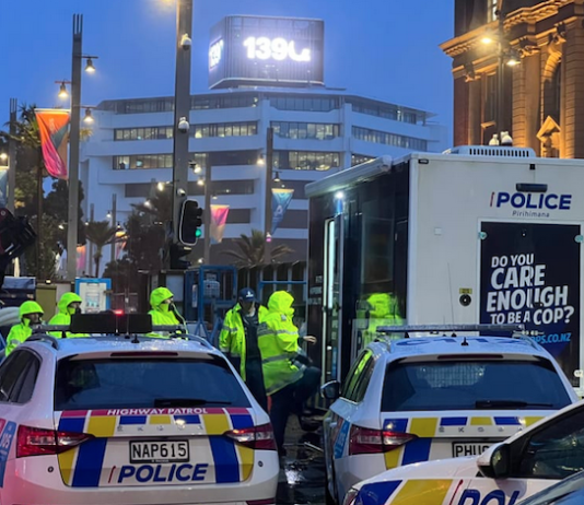 Police officers in high-vis vests have today re-entered the high-rise Auckland central building