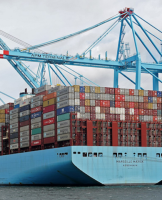 Huge container ships carrying import and export marine cargo loads