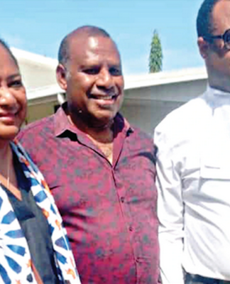 Sidelined PNG Justice Secretary Dr Eric Kwa (centre) pictured with his lawyer Emmanuel Asigau
