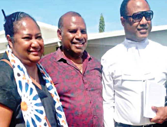 Sidelined PNG Justice Secretary Dr Eric Kwa (centre) pictured with his lawyer Emmanuel Asigau