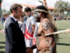Macron urges Kanaky New Caledonia ‘compatriots’ to chart united path French President Emmanuel Macron shakes hands with a traditional Kanak dancer