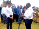 Prime Minister James Marape presenting a traditional eagle wood spear with totems to French President Emmanuel Macron