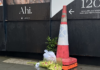 Orchids left at the Auckland construction site in memory of the two dead victims