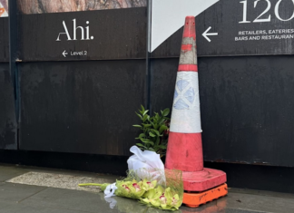 Orchids left at the Auckland construction site in memory of the two dead victims