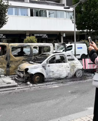 Burnt-out cars in the Northern suburbs of Paris, Sarcelles