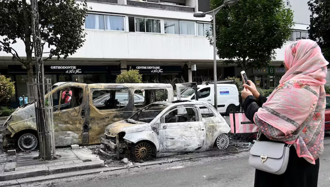 Burnt-out cars in the Northern suburbs of Paris, Sarcelles