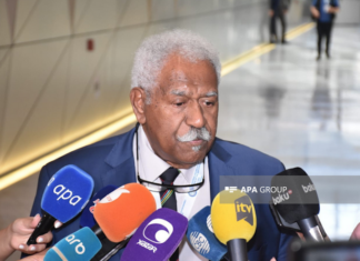 New Caledonia's Assembly President Roch Wamytan talking to news media in Baku
